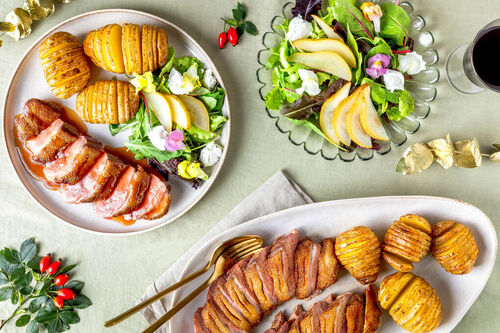 Eendenborst op perensalade met geitenkaas