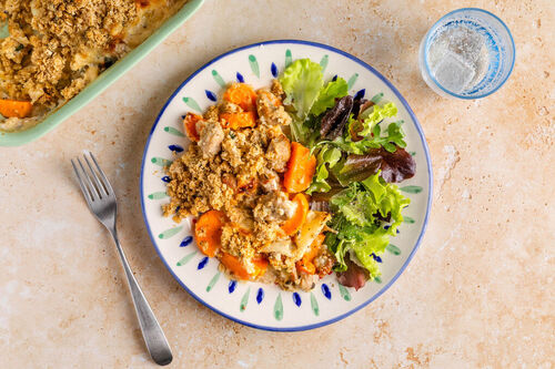 Gratin van zoete aardappel en varkenssaucijs