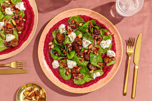 Bio-rundersaucijs met burrata en amandelen